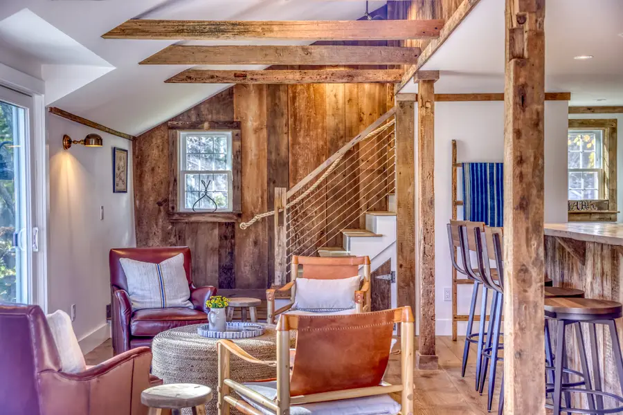 Lounge with the staircase built from the original barn wood