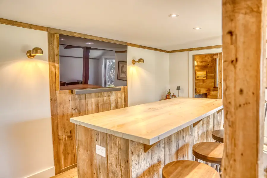 Bar counter with a TV wall in barn board