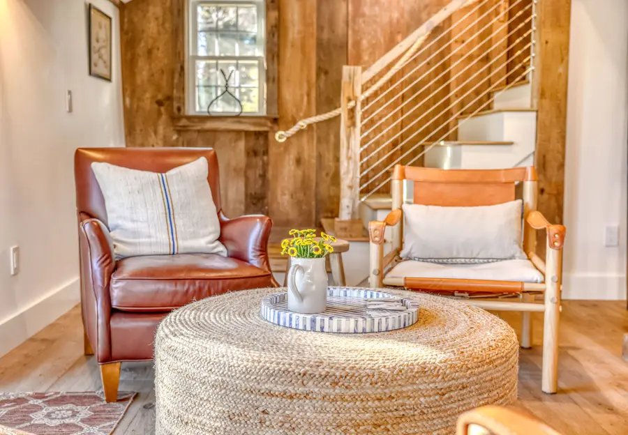Leather chairs at the foot of the stairs