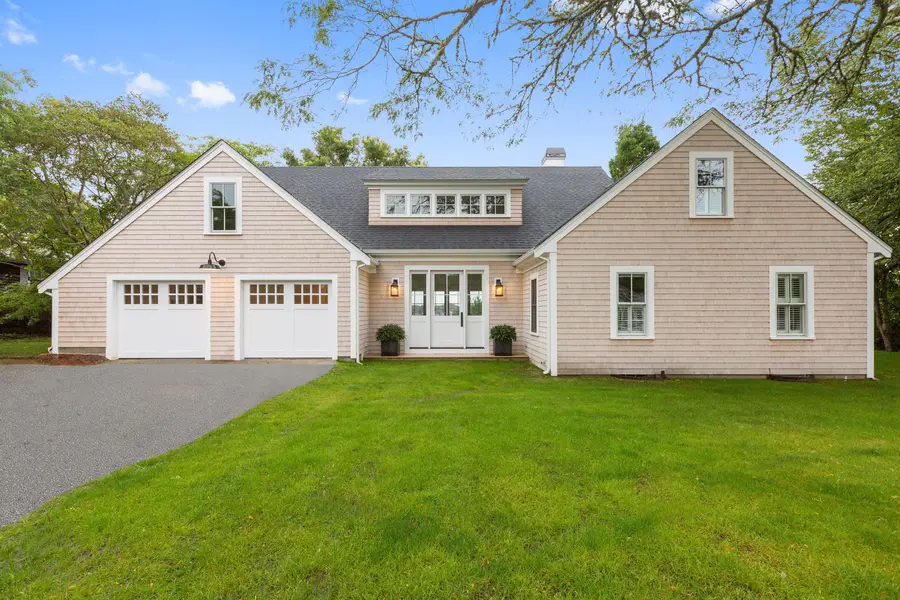 New shingled home with a two-car garage on the Bass River