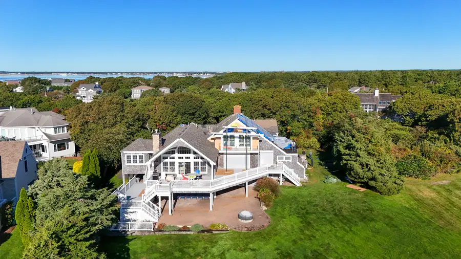 Great Island home and deck with the water behind it