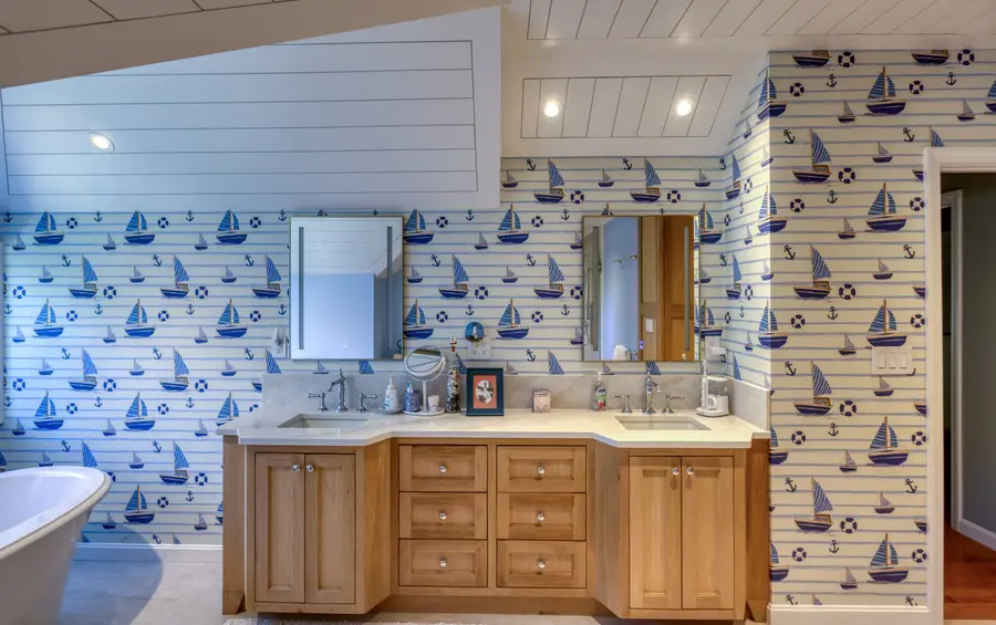 Double vanity in natural wood with sailboat wallpaper