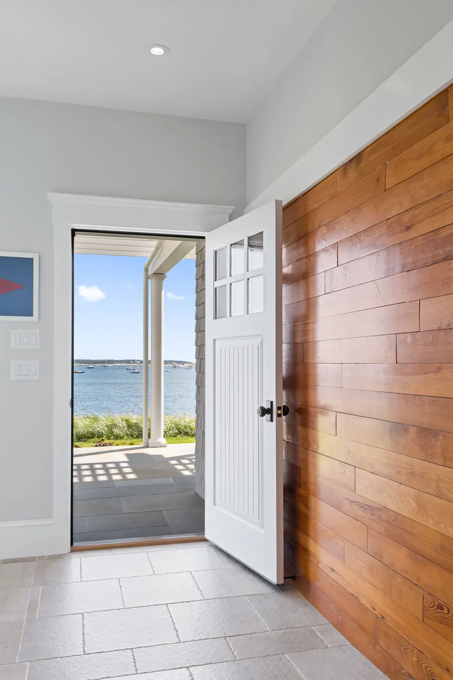 Wood entry door opening straight onto the water