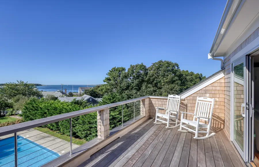 Rocking chairs on the deck above the pool