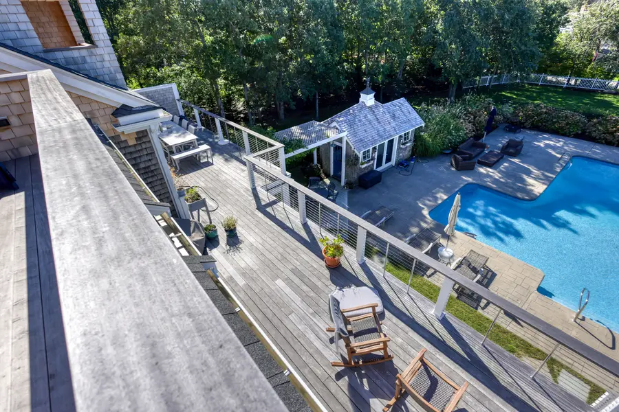Pool and pool house seen from the deck