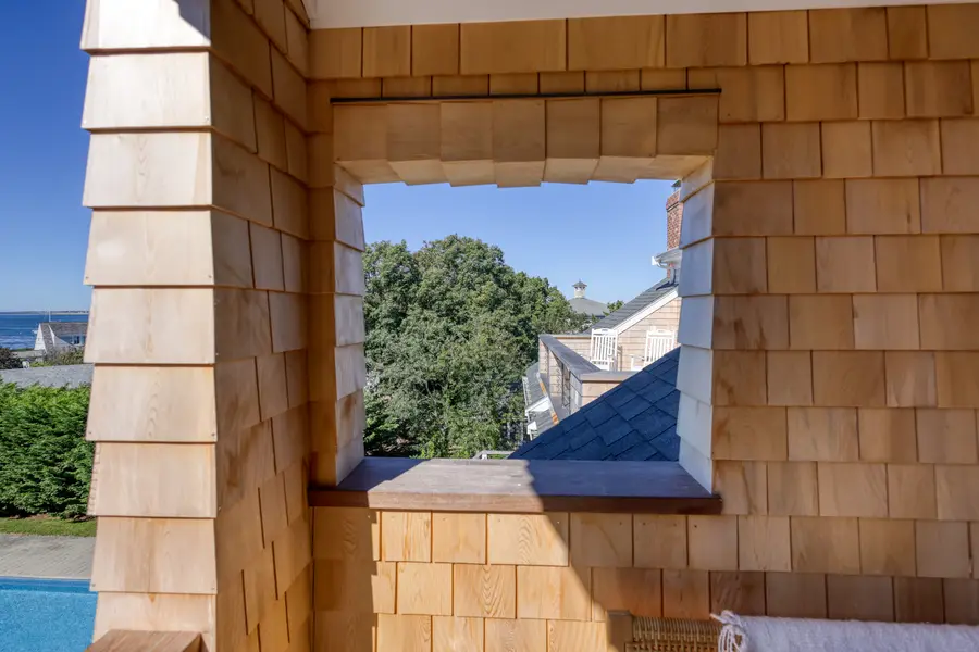 Shingled porch opening framing the trees