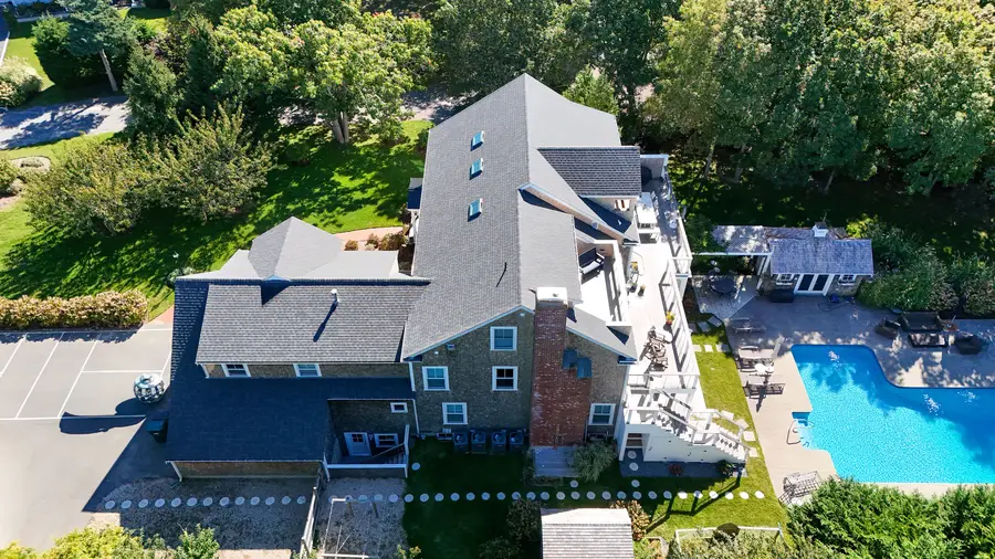 The house with the pool beside it, from above