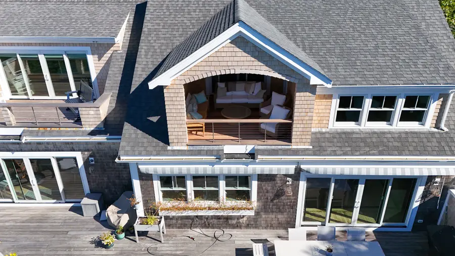 Covered porch tucked into the center dormer