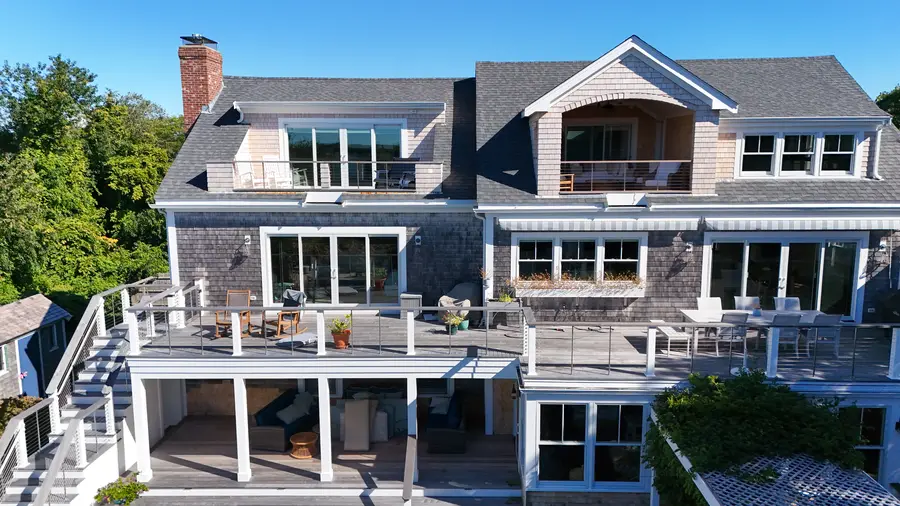 Three levels of decks across the back of the house