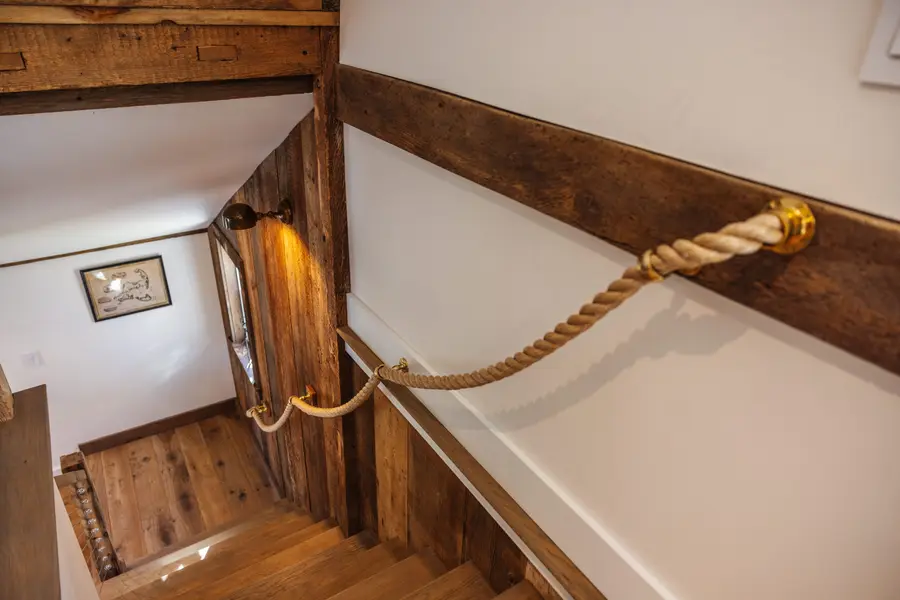Rope handrail on a barn staircase