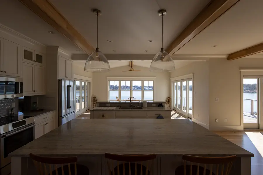 Dining table at the island with river views through the back windows