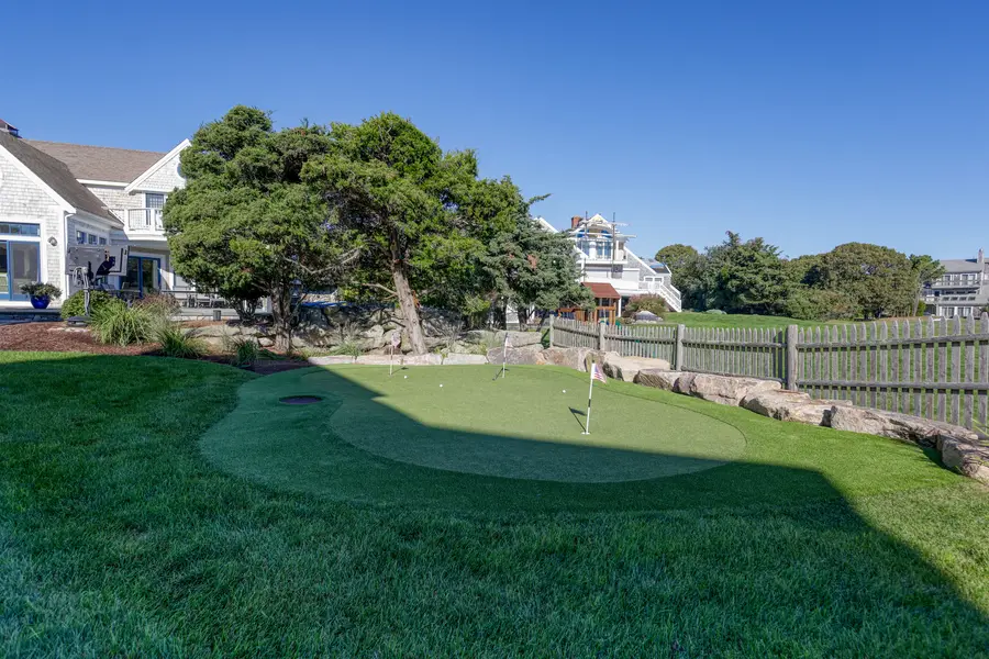 Private putting green in the side yard