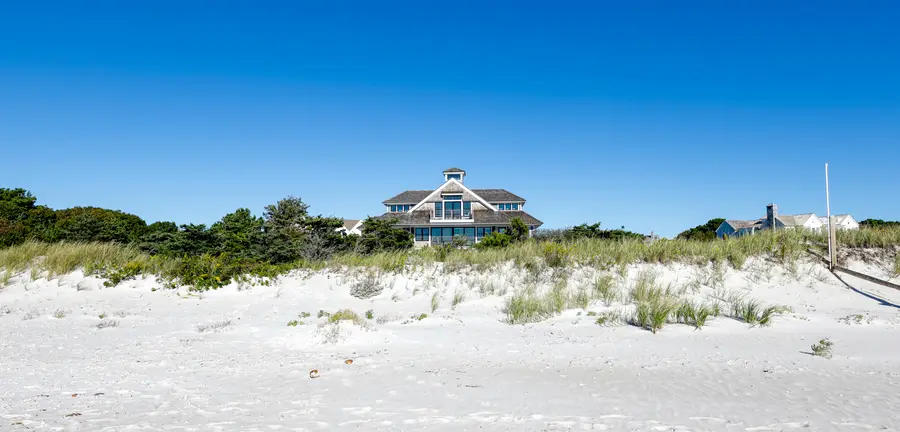 The house seen from the beach, past the dunes