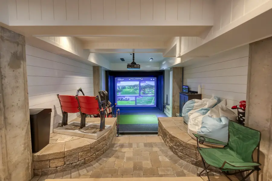 Lounge with the golf simulator and shiplap walls