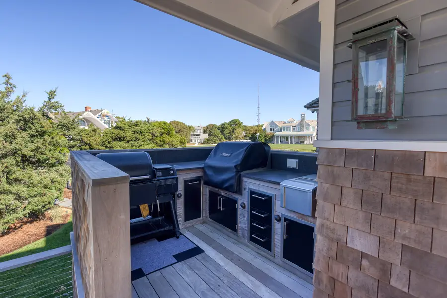 Outdoor kitchen with grill on the deck