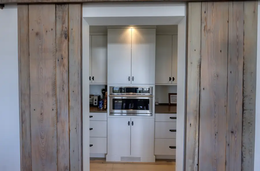 Barn-door pantry with built-ins